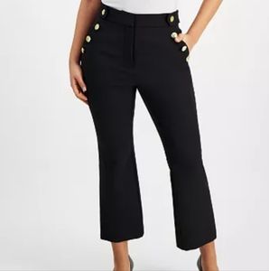 Black slacks with buttons on each side